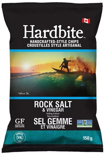 Hardbite handcrafted-style chips packaging with a sunset and surfboard design.