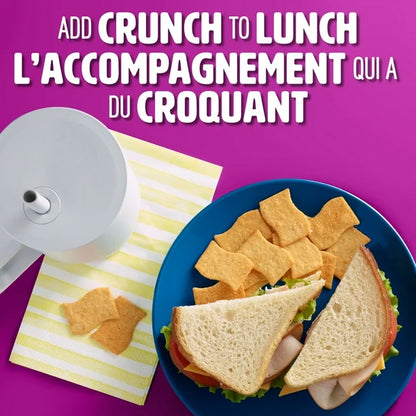 Plate with sandwich and chips on a purple background with text about adding crunch to lunch.